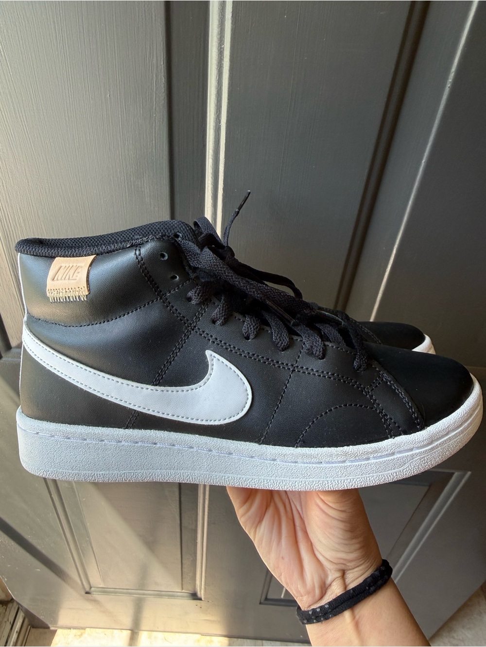 Nike Black High-Top Sneakers with White Swoosh